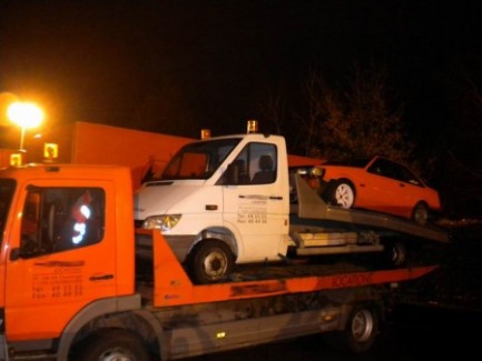 Tow truck towing a hachi towing truck